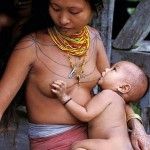 Mentawai woman breastfeeding her baby. Photographed on Siberut Island Mentawai Archipelago Sumatra Indonesia Sciencephoto