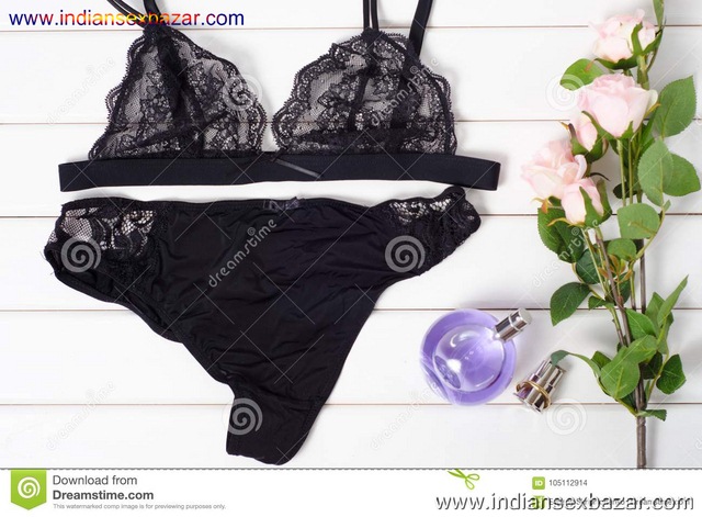 Black Bra Panties Perfume Flowers Black Bra Panties Perfume Flowers White Wooden Background 105112914