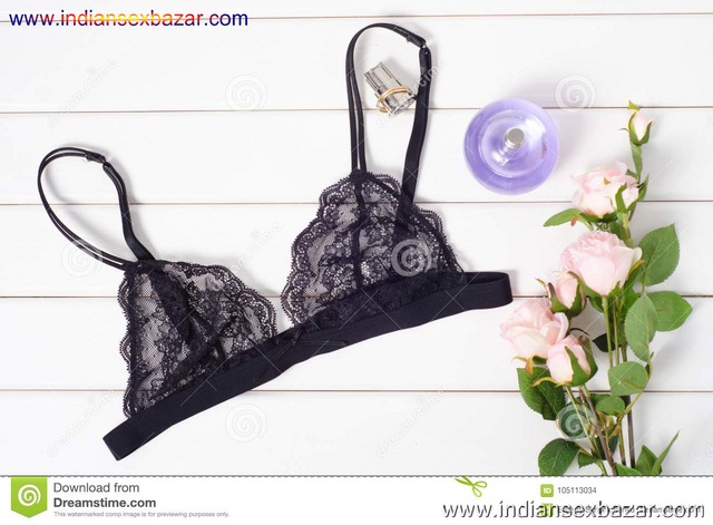 Black Bra Perfume Flowers Black Bra Perfume Flowers White Wooden Background 105113034